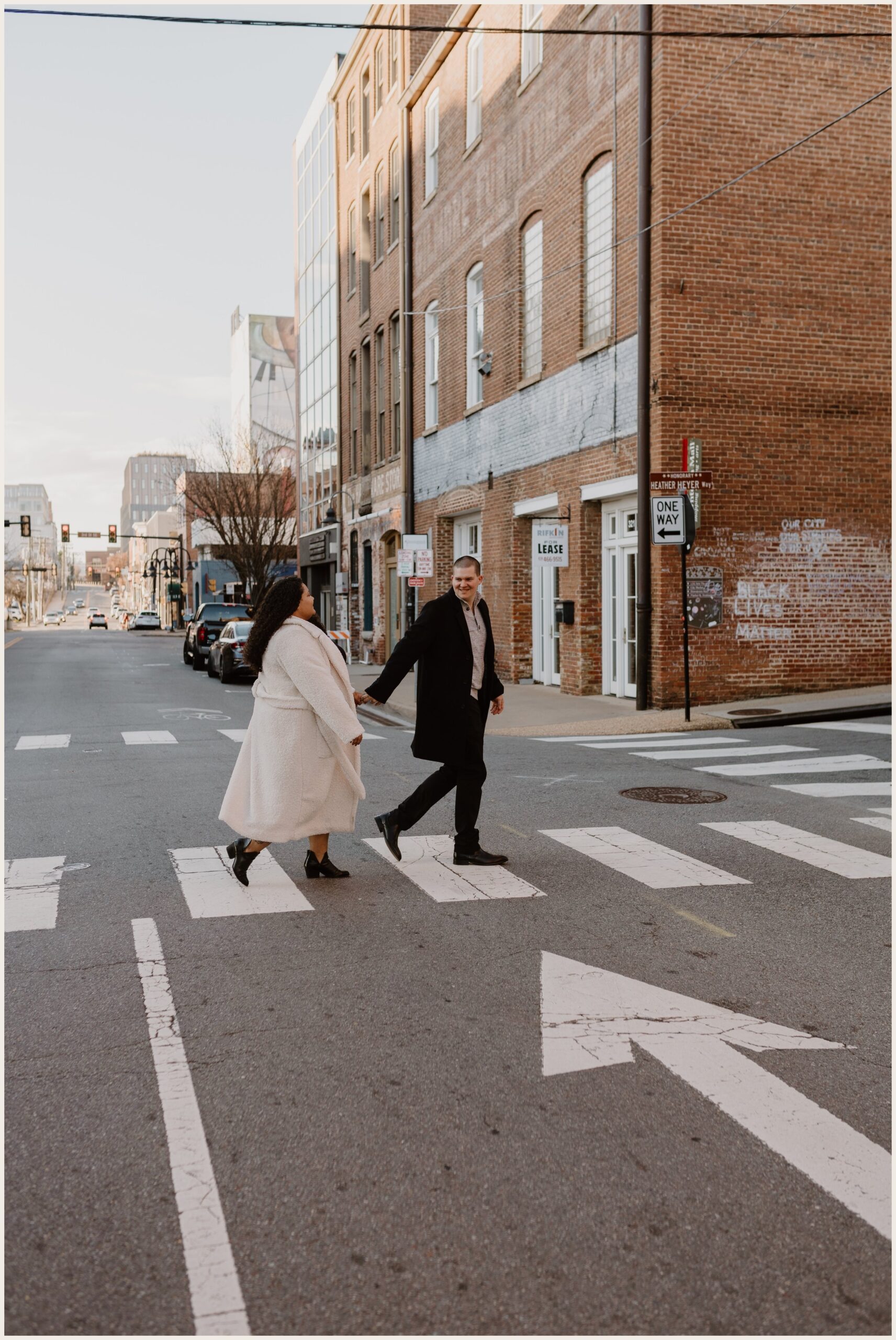  Couple holding hands crossing the street 