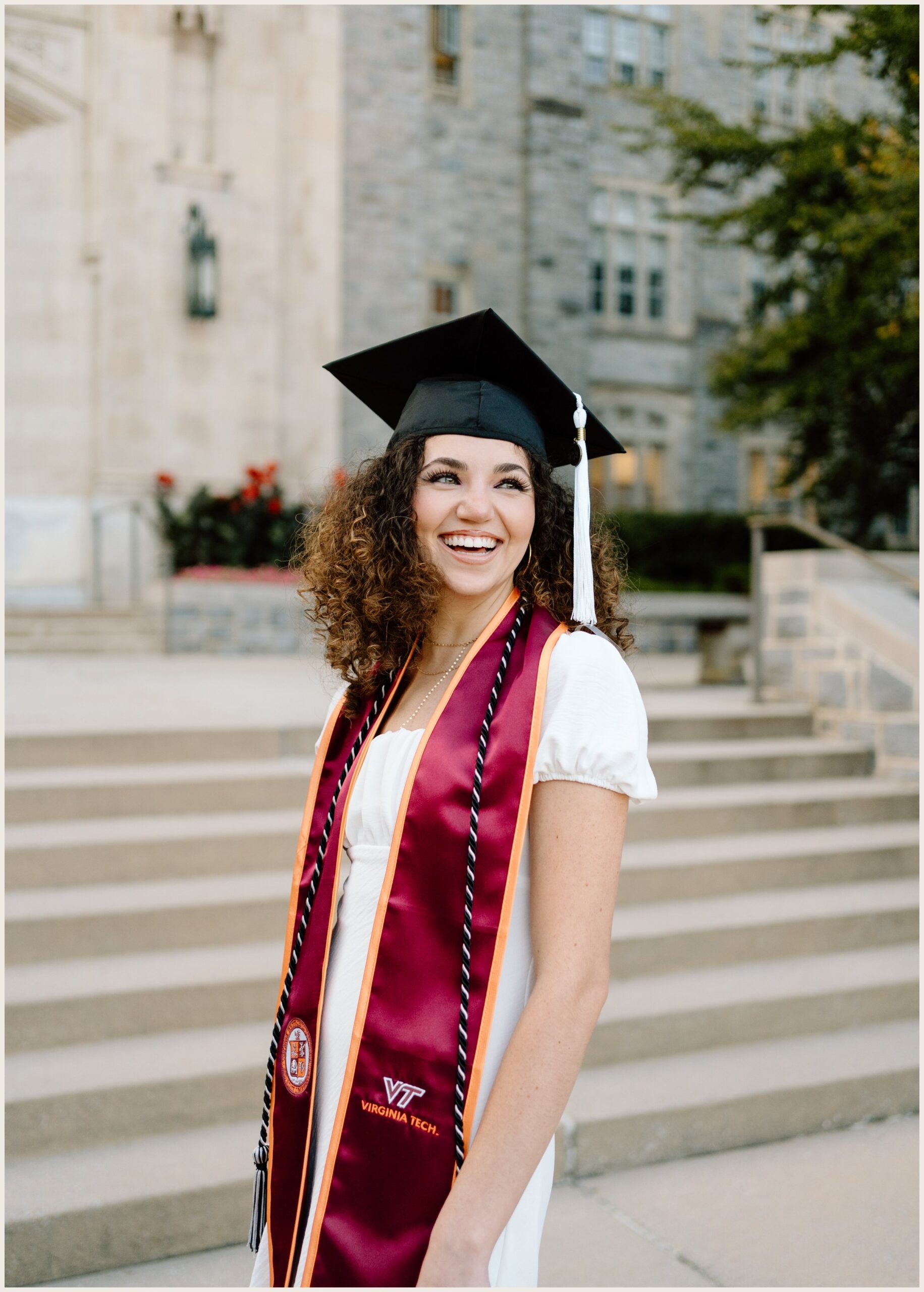 Virginia Tech graduation portrait of a woman at Burruss Hall